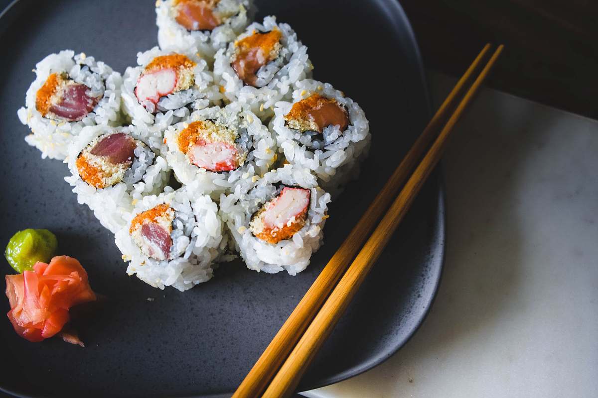 ice cream sushi food with brown wooden chopsticks cream